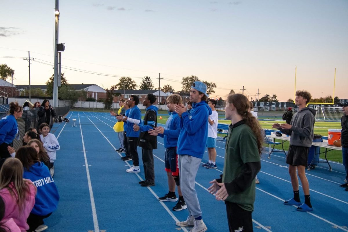 The cheerleaders cheering loud for their fans.