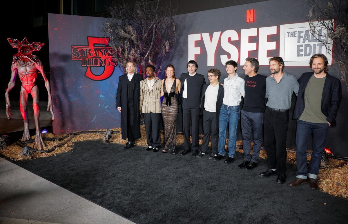 Cast members Jamie Campbell Bower, Caleb McLaughlin, Millie Bobby Brown, Noah Schnapp, Gaten Matarazzo, Finn Wolfhard, Creators Matt Duffer, Ross Duffer and Executive Producer Shawn Levy attend a photocall at the Netflix Tudum Theater in Hollywood for an event to help kick off the Stranger Things final season in Los Angeles, California, U.S. November 8, 2025.  REUTERS/Mike Blake