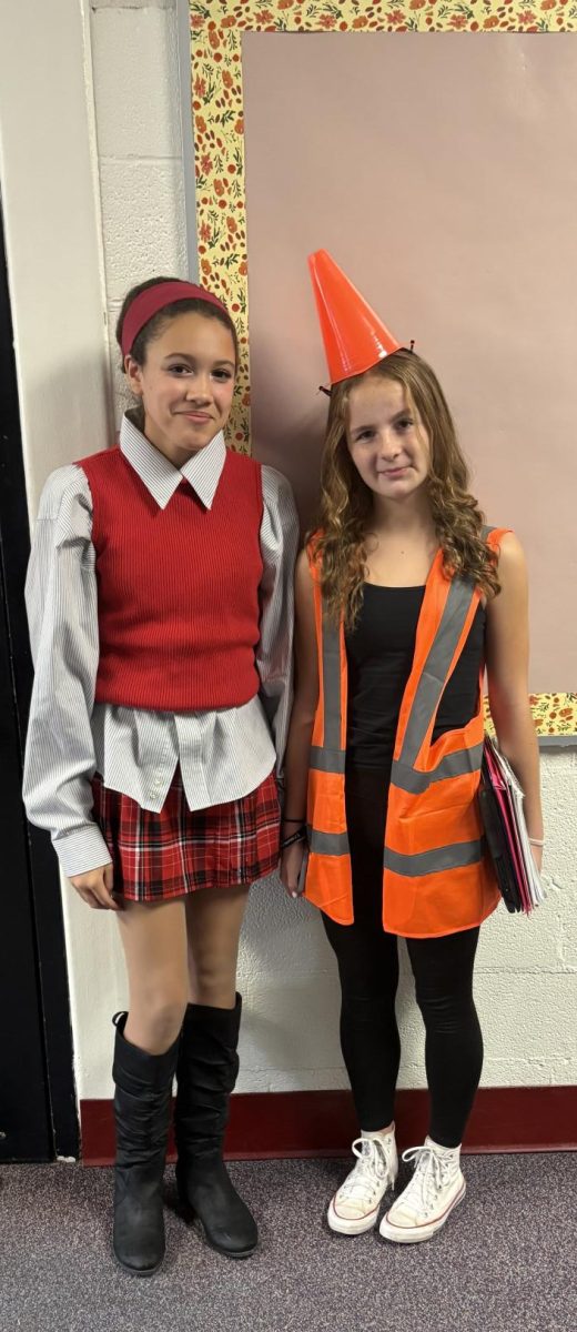 Picture of Eilah Bullard dressed as Cher Horowitz and Clarice  Ritter dressed as a construction cone