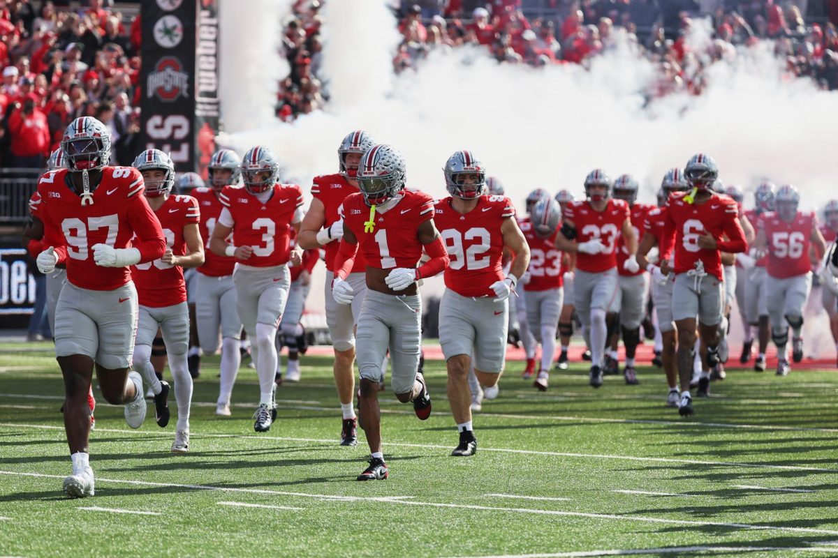 Nov 22, 2025; Columbus, Ohio, USA; Ohio State Buckeyes players run onto the field before the game against the Rutgers Scarlet Knights at Ohio Stadium. Mandatory Credit: Joseph Maiorana-Imagn Images