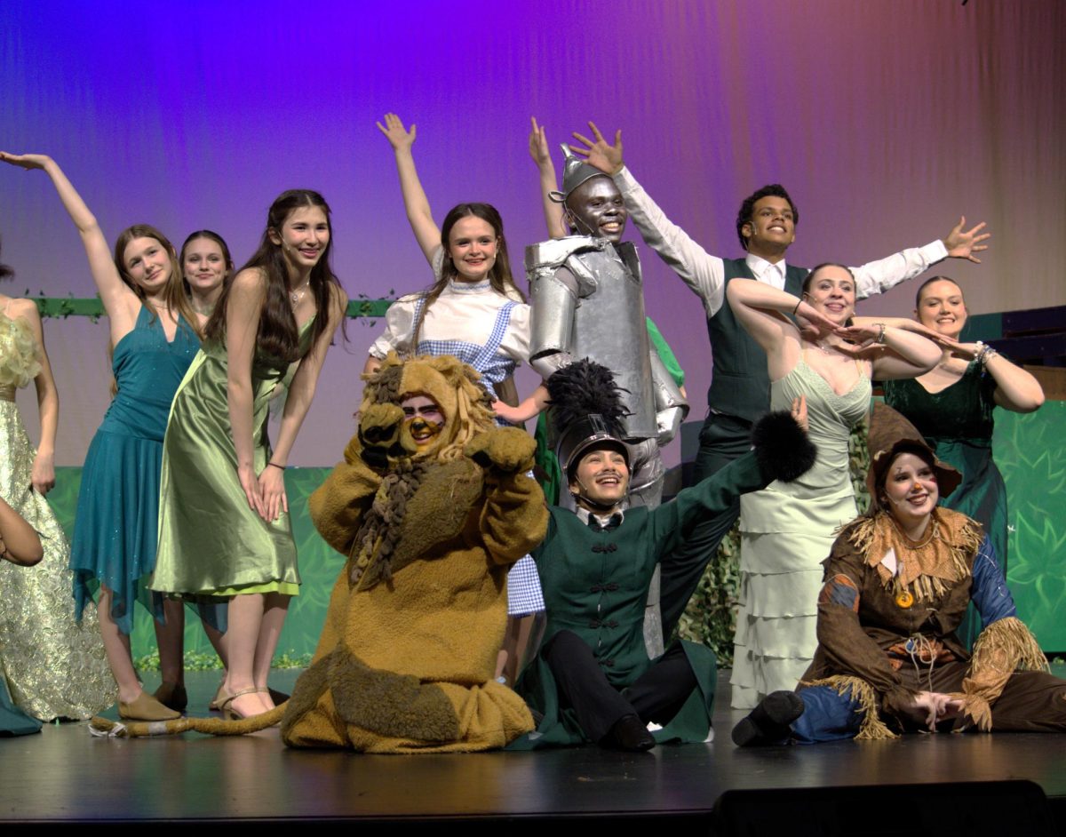 Cast members from The Wizard of Oz at the end of the song "Merry Old Land of Oz"