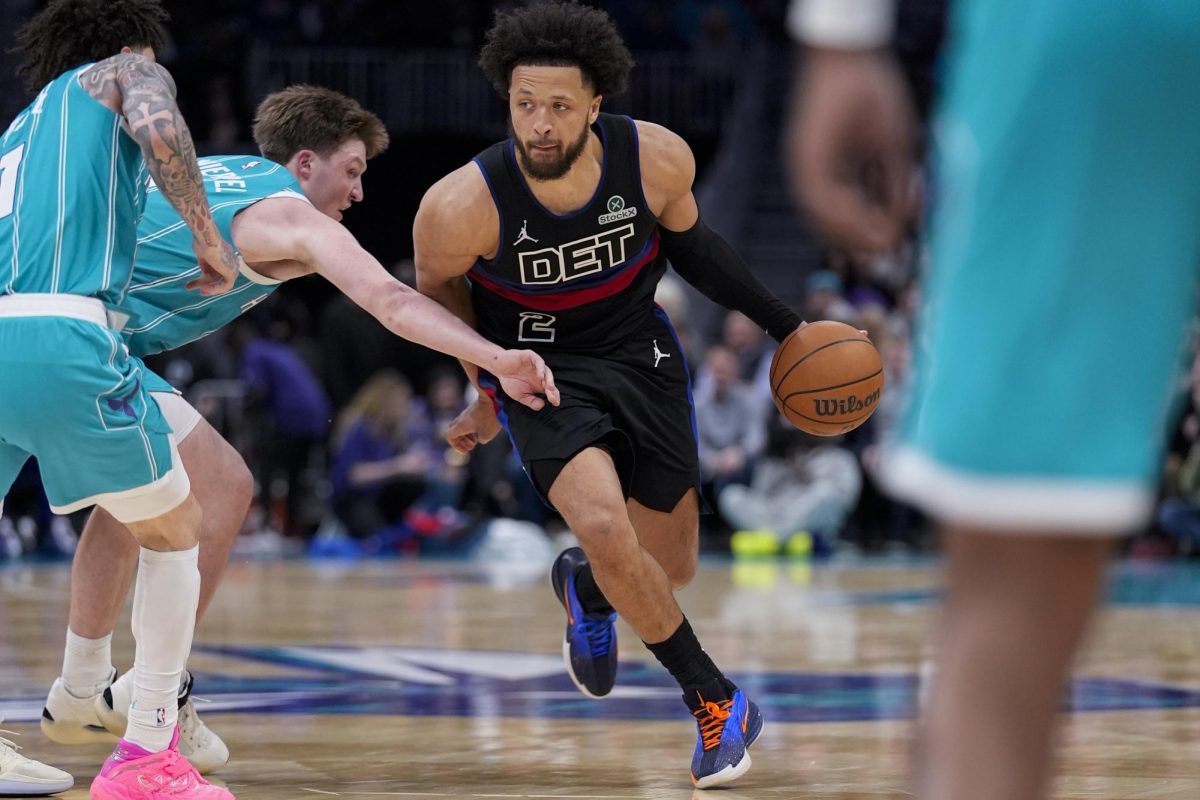 Feb 9, 2026; Charlotte, North Carolina, USA; Detroit Pistons guard Cade Cunningham (2) drives to the basket against Charlotte Hornets guard/forward Kon Knueppel (7) during the second half at Spectrum Center. Jim Dedmon-Imagn Images