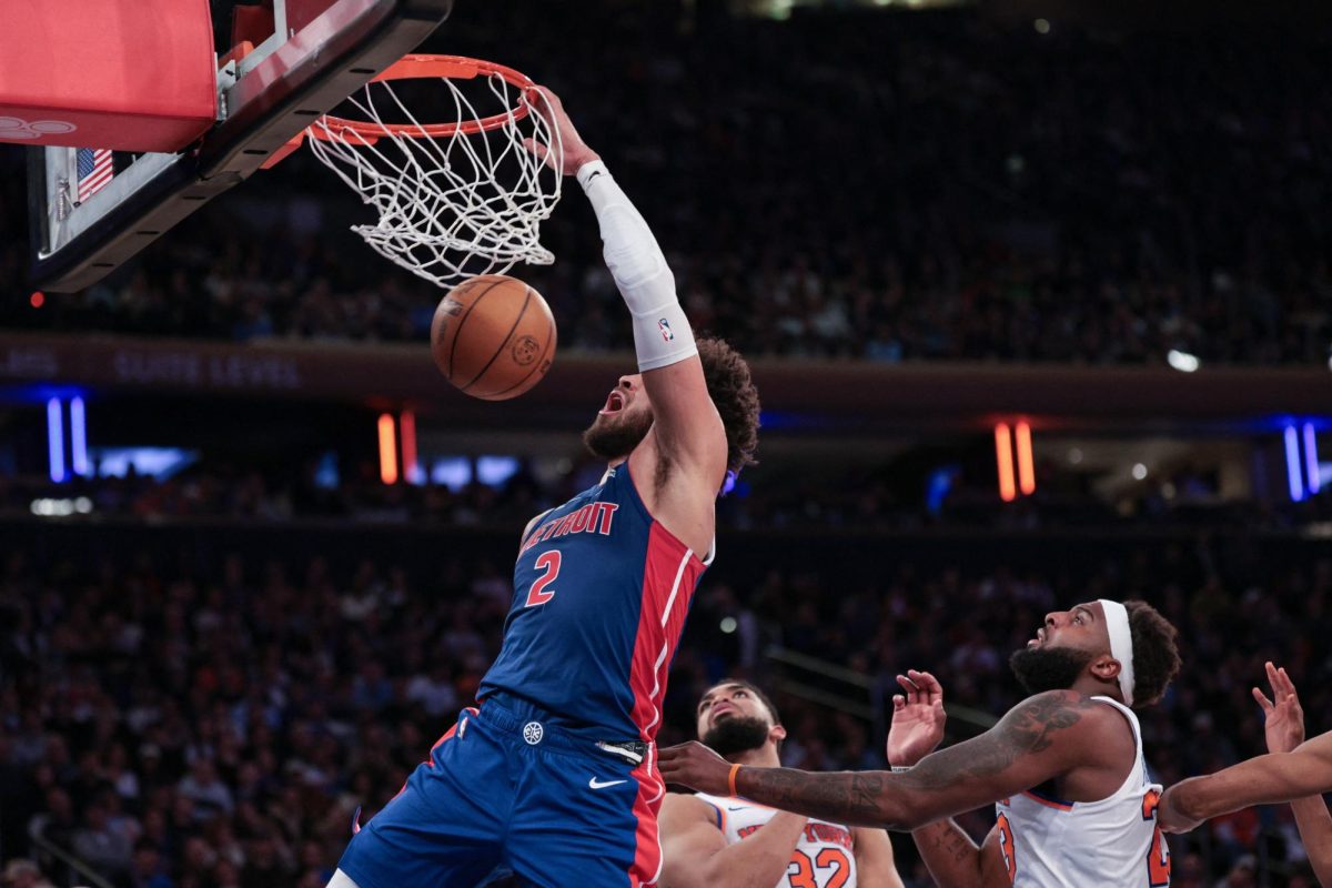 Feb 19, 2026; New York, New York, USA; Detroit Pistons guard Cade Cunningham (2) dunks against New York Knicks center Karl-Anthony Towns (32) during the second half at Madison Square Garden. Mandatory Credit: Vincent Carchietta-Imagn Images