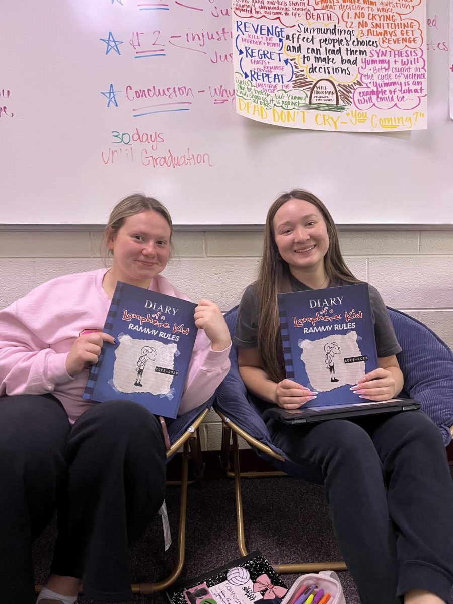 Ellie Rogensues and Sophie Najar holding up their brand new yearbooks!